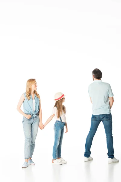 Full length view of mother and daughter looking at man isolated on white — Stock Photo