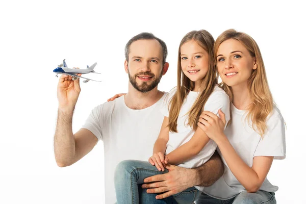Happy smiling family with plane model isolated on white — Stock Photo