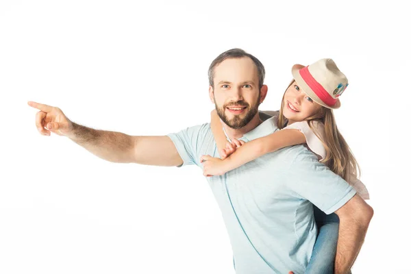 Happy father piggybacking daughter and pointing with finger away isolated on white — Stock Photo