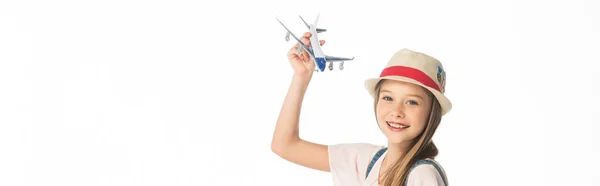Cheerful girl in hat with plane model isolated on white, panoramic shot — Stock Photo