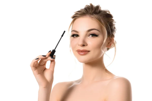 Naked beautiful blonde woman with makeup and black nails holding mascara isolated on white — Stock Photo