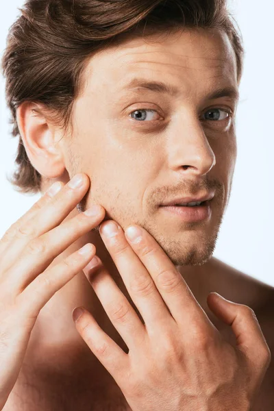 Shirtless man touching skin on cheek isolated on white — Stock Photo