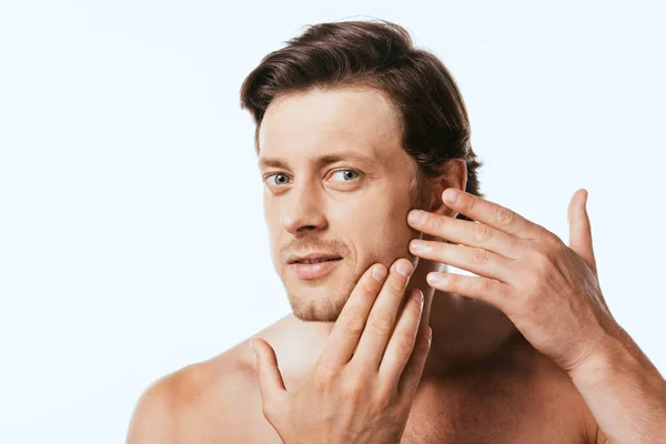 Young shirtless man touching cheek isolated on white — Stock Photo