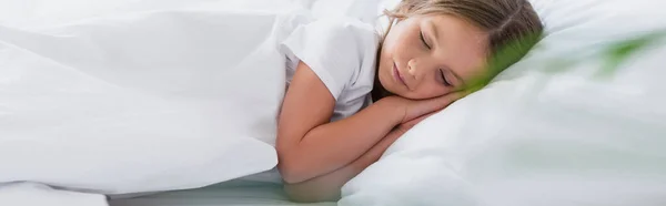 Panoramic concept of girl sleeping while lying on white bedding — Stock Photo