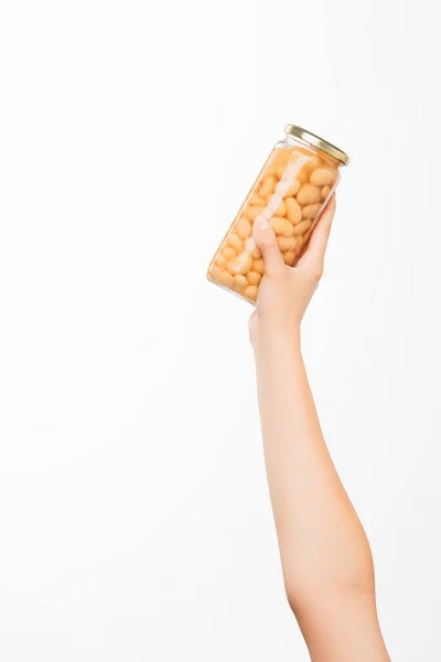 Cropped view of woman holding canned beans isolated on white, charity concept — Stock Photo