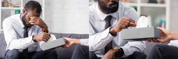 Collage of stressed african american man covering eyes with hand and taking paper napkin from psychologist, panoramic orientation — Stock Photo