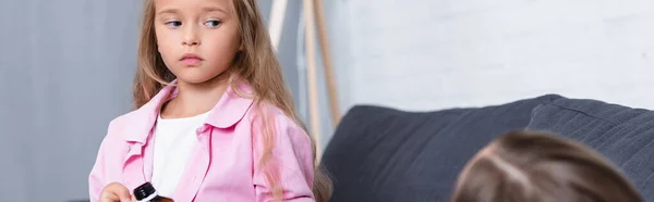 Panoramic shot of kid holding bottle of syrup near sick mother — Stock Photo