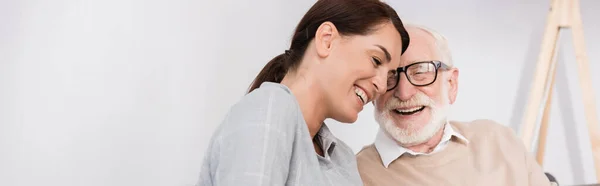 Cheerful aged man and adult daughter talking at home, banner — Stock Photo