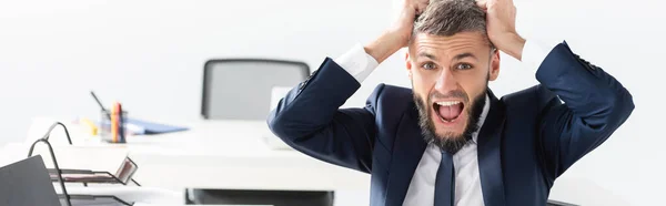 Screaming businessman looking at camera in office, banner — Stock Photo