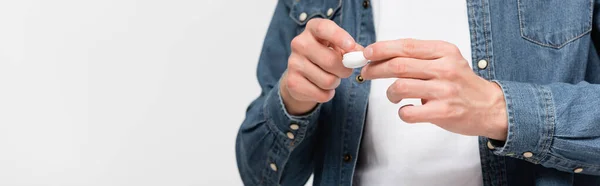 Cropped view of man holding box with contact lens isolated on grey, banner — Stock Photo