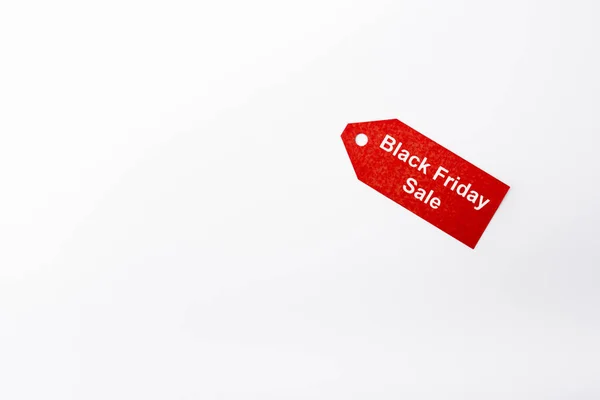 Top view of price tag with black friday sale lettering on white background — Stock Photo