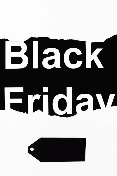 Letras de sexta-feira preta e etiqueta de preço no fundo branco e preto — Fotografia de Stock