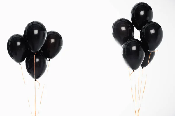 Festliche Luftballons an Schnüren isoliert auf weiß — Stockfoto