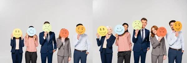Collage of multicultural businesspeople holding cards with emotions isolated on grey, banner — Stock Photo