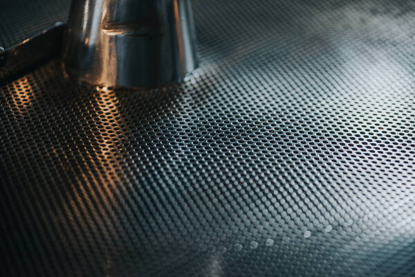 Metal grid texture of coffee roasting machine