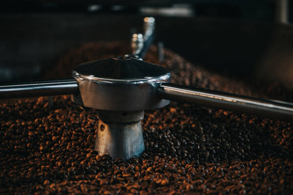 Traditional coffee roaster cooling of fresh roasted coffee beans