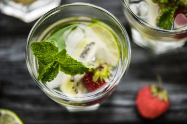 top view of fresh strawberry kiwi mojito cocktail in glass clipart