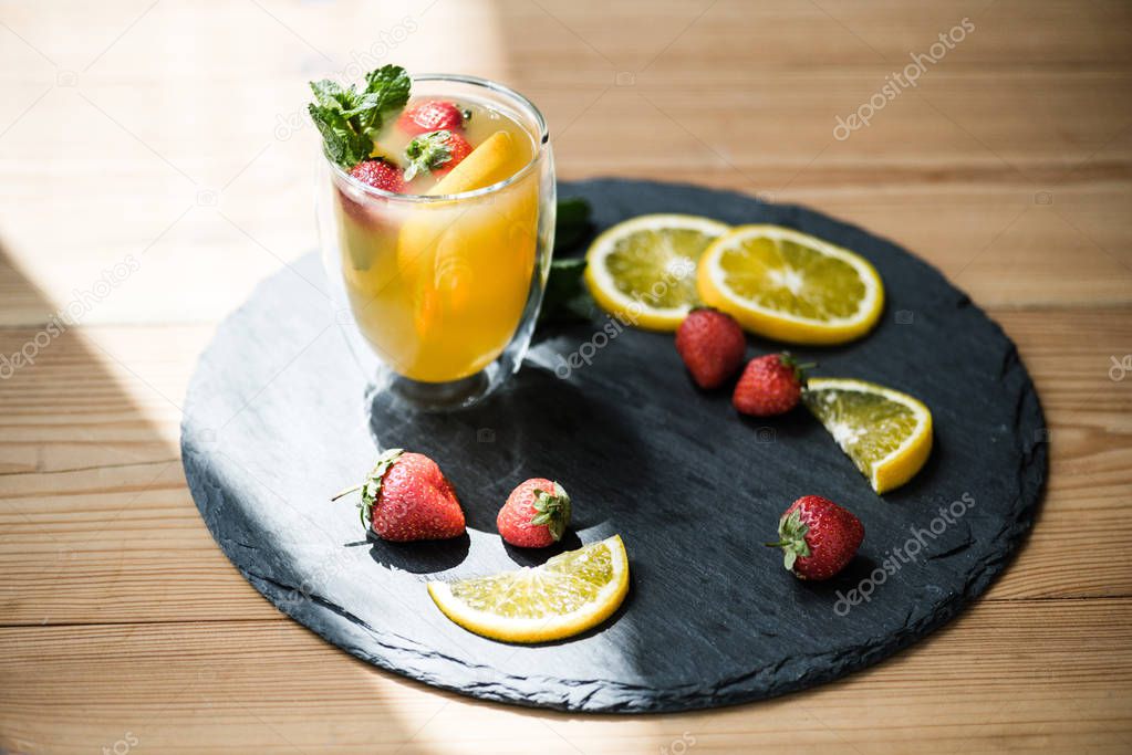close-up view of delicious refreshing summer cocktail in glass on slate board