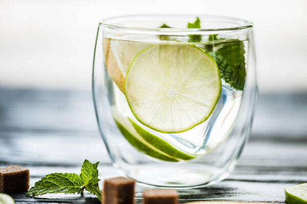 close-up view of glass with fresh cold mojito 