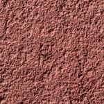 Close-up view of maroon concrete wall textured background