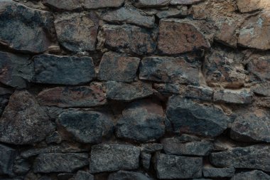 close-up view of dark grey stone wall texture clipart