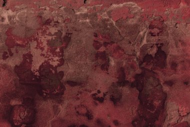 full frame view of dark red cracked wall textured background    clipart