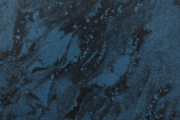 close-up view of black and blue marble textured background      