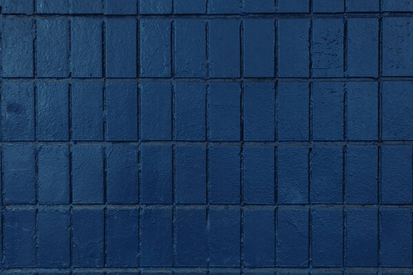 dark blue wall with old bricks, full frame background   