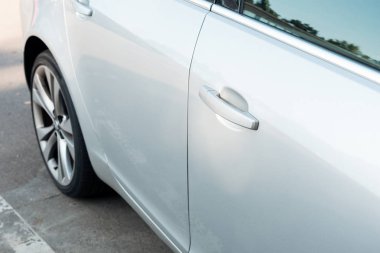 detail of parked shiny white car, transport background clipart