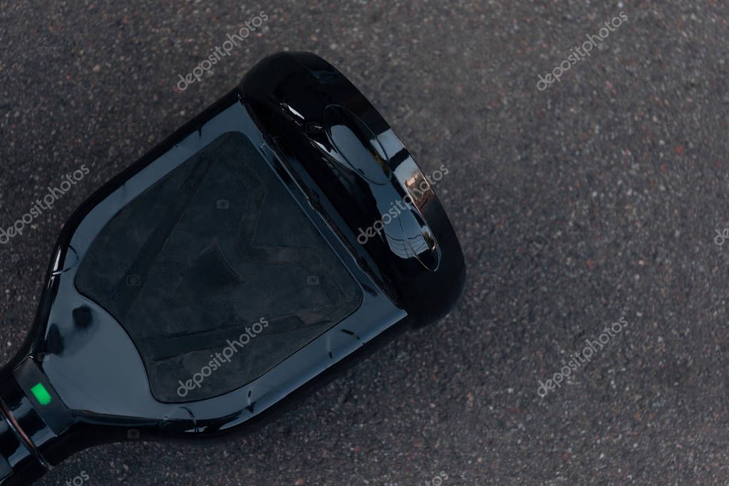 Top view of black self-balancing board on street