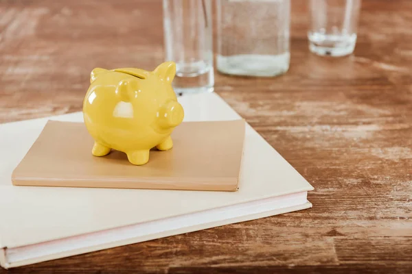 Close View Yellow Piggy Bank Textbook Book Wooden Table — Stock Photo, Image