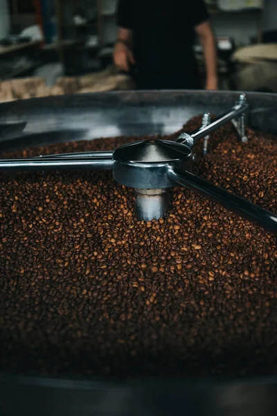 Close-up view of coffee beans roasted in professional machine — Stock Photo