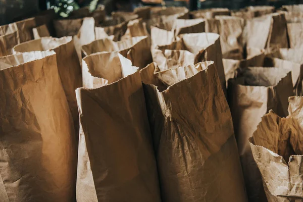 Rows of paper bags with coffee for selling — Stock Photo