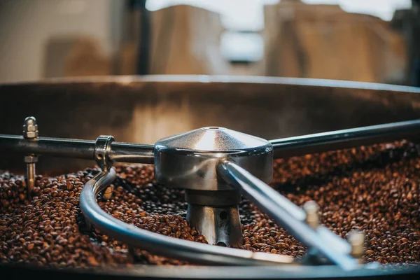 Traditional coffee roaster with coffee beans in cylinder — Stock Photo