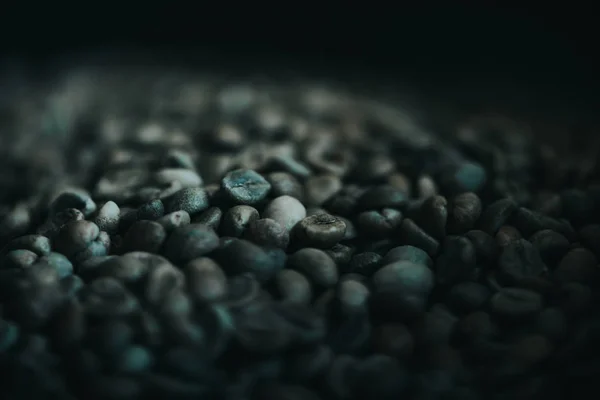 Dark coffee beans texture during roasting process — Stock Photo