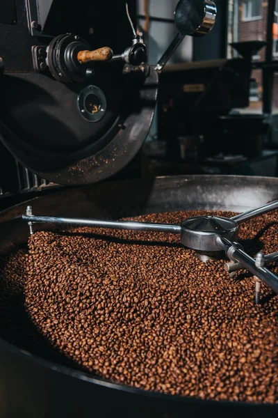 Roasting coffee beans in industrial coffee roaster — Stock Photo