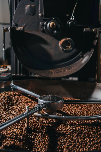 Roasting coffee beans in large professional coffee roaster — Stock Photo