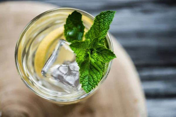 Top view of cold fresh summer cocktail with mint and ice cubes in glass — Stock Photo