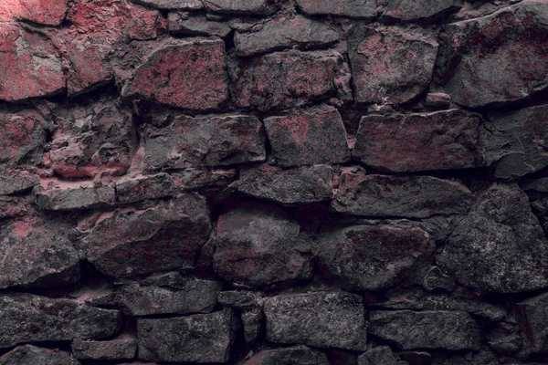 Vue rapprochée du vieux mur de pierre altérée fond texturé — Photo de stock