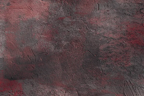 Vista de cerca de fondo texturizado de pared áspera gris oscuro y rojo - foto de stock