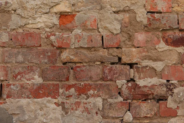 Old cracked brown brick wall textured background — Stock Photo
