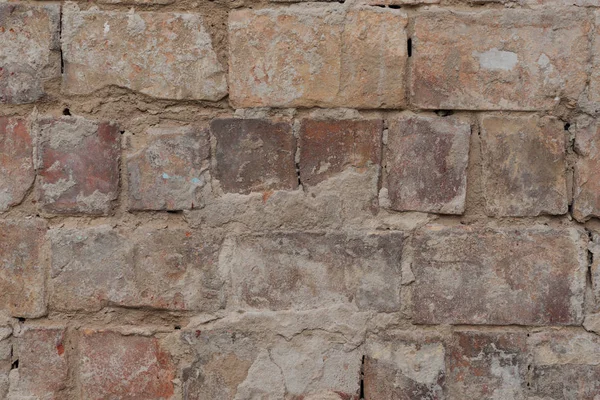 Close up view of old cracked brick wall textured background — Stock Photo