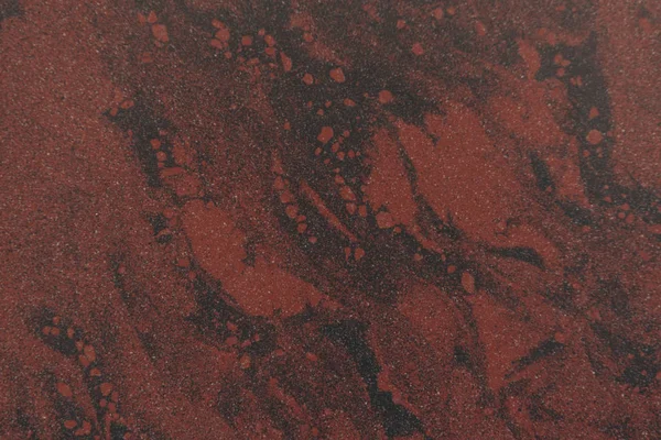 Vista de cerca del fondo texturizado de mármol negro y marrón - foto de stock