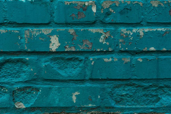 Vue rapprochée de vieux murs de briques turquoise altérés — Photo de stock