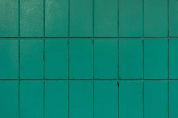 Dark green old wall with painted bricks, full frame background — Stock Photo
