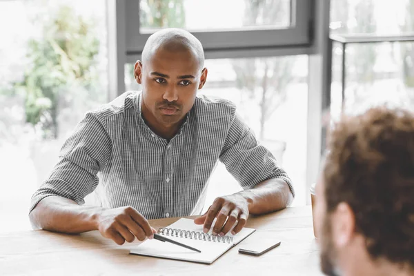 Portrait Focused African American Businessman Listening Colleague Business Meeting Stock Image