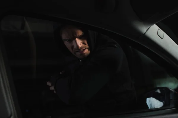 Serious Male Robber Black Hoodie Breaking Car Window Elbow — Stock Photo, Image