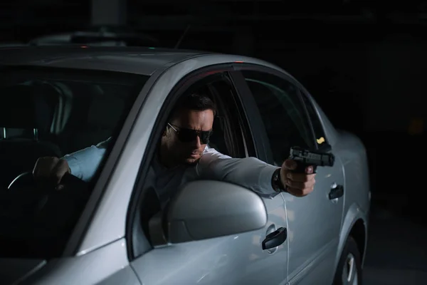 Male Private Detective Sunglasses Aiming Gun Car — Stock Photo, Image