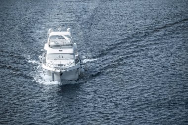 aerial view of white ship sailing on blue sea clipart