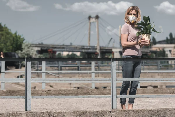 Woman Protective Mask Holding Potted Plant Bridge Looking Away Air — Stock Photo, Image